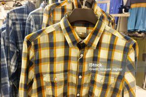 Indian men latest fashion shirts in display retail shop in market, traditional wear for men India.